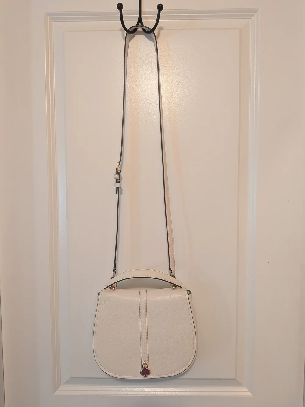 kate spade Cream Pebbled Leather Saddle Crossbody with Gold Heart Charm